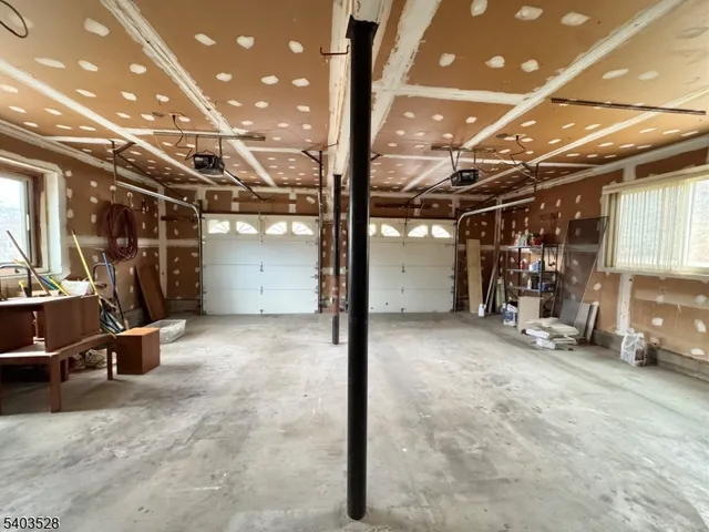 a view of a garage with parked cars