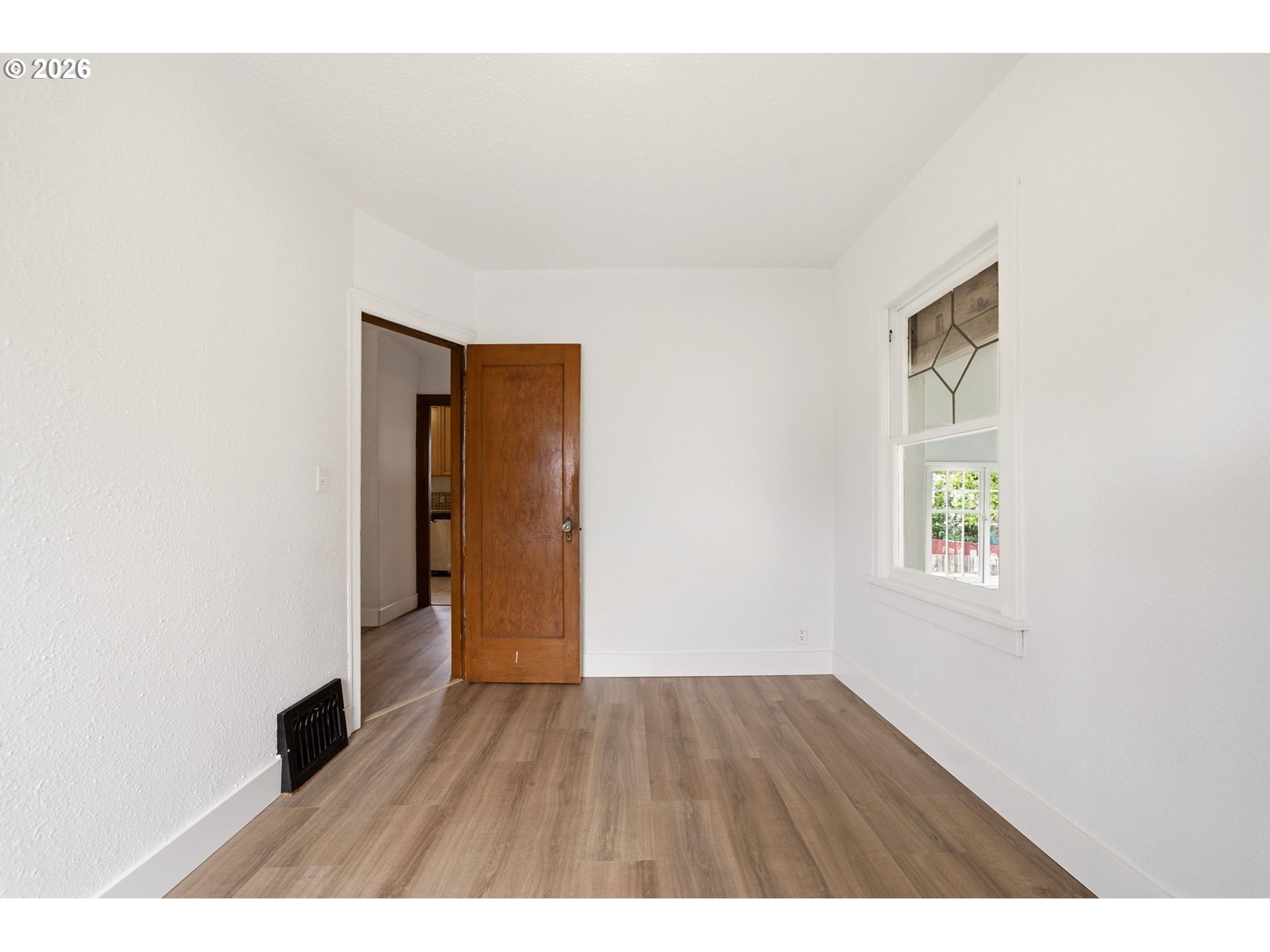 1804 Division Street Camas, WA 98607 - Photo 14 of 43 a view of an empty room with wooden floor