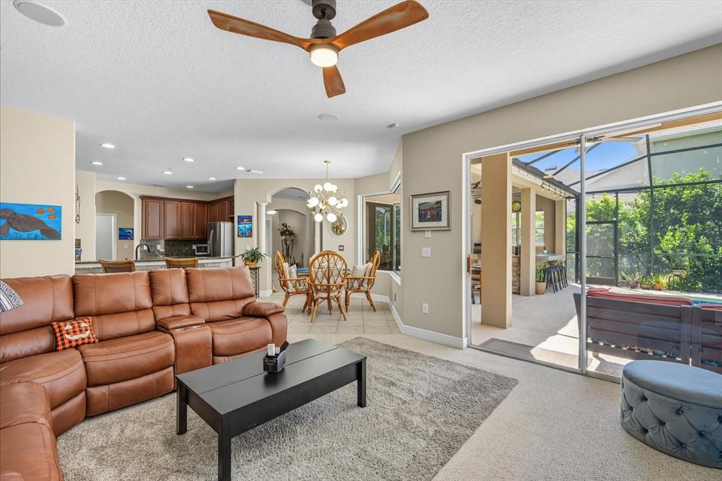 6107 Ibispark Drive Lithia, FL 33547 - Photo 13 of 42 a living room with furniture and a large window