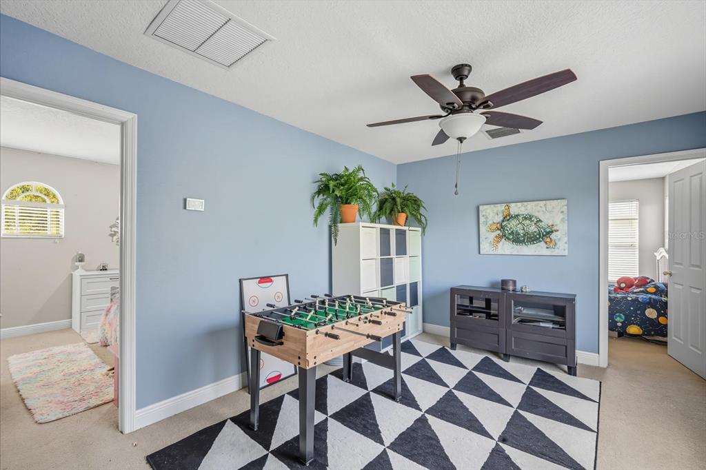 6107 Ibispark Drive Lithia, FL 33547 - Photo 24 of 42 a living room with furniture and a window