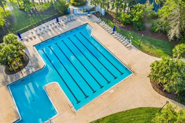 a view of a swimming pool with a chairs