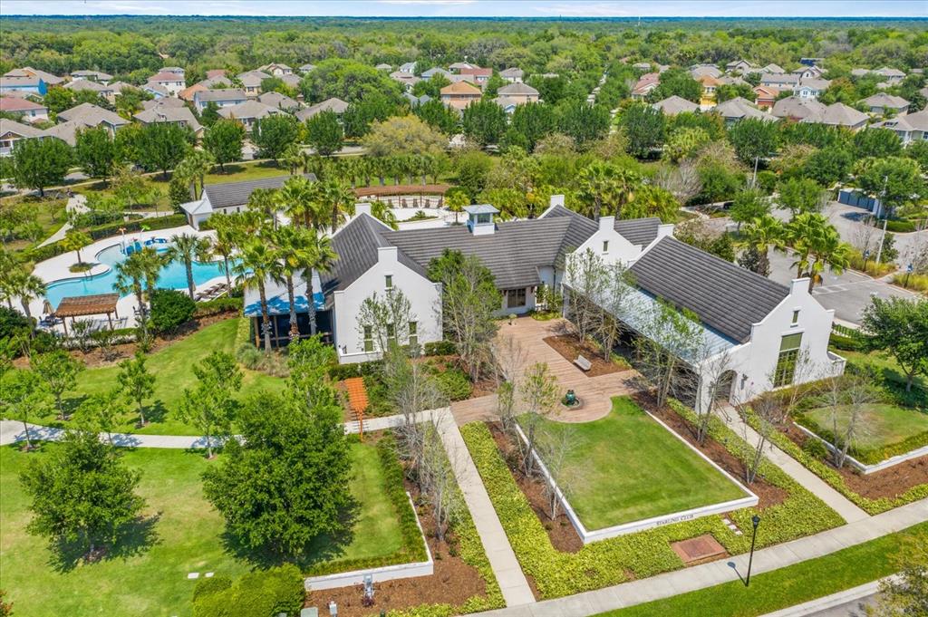 6107 Ibispark Drive Lithia, FL 33547 - Photo 40 of 42 an aerial view of residential houses with outdoor space and parking