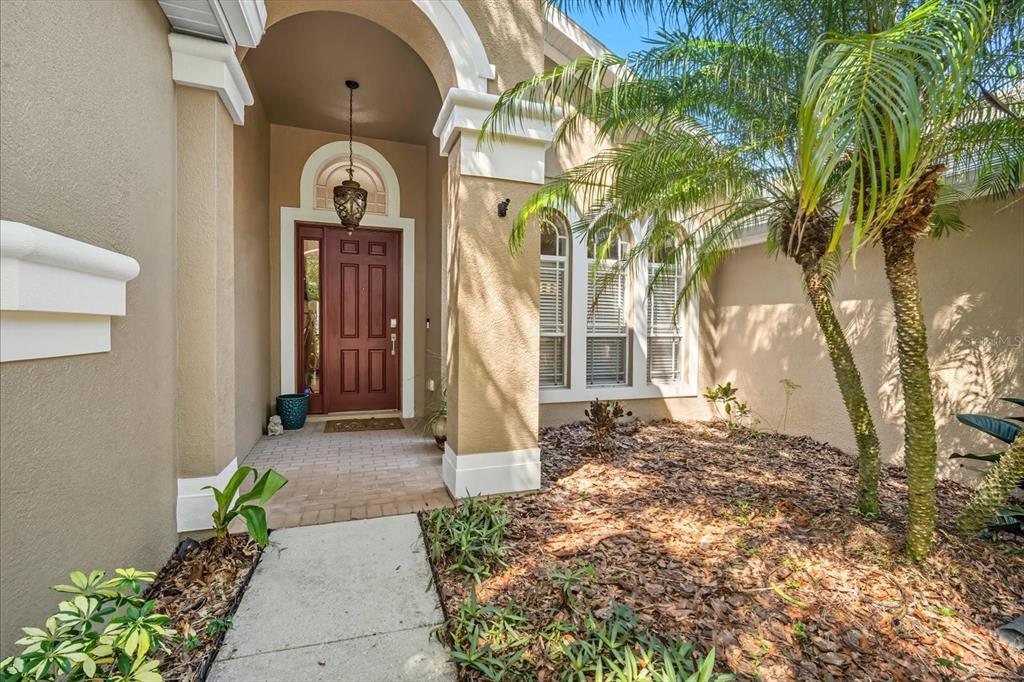 6107 Ibispark Drive Lithia, FL 33547 - Photo 5 of 42 a front view of a house with a garden