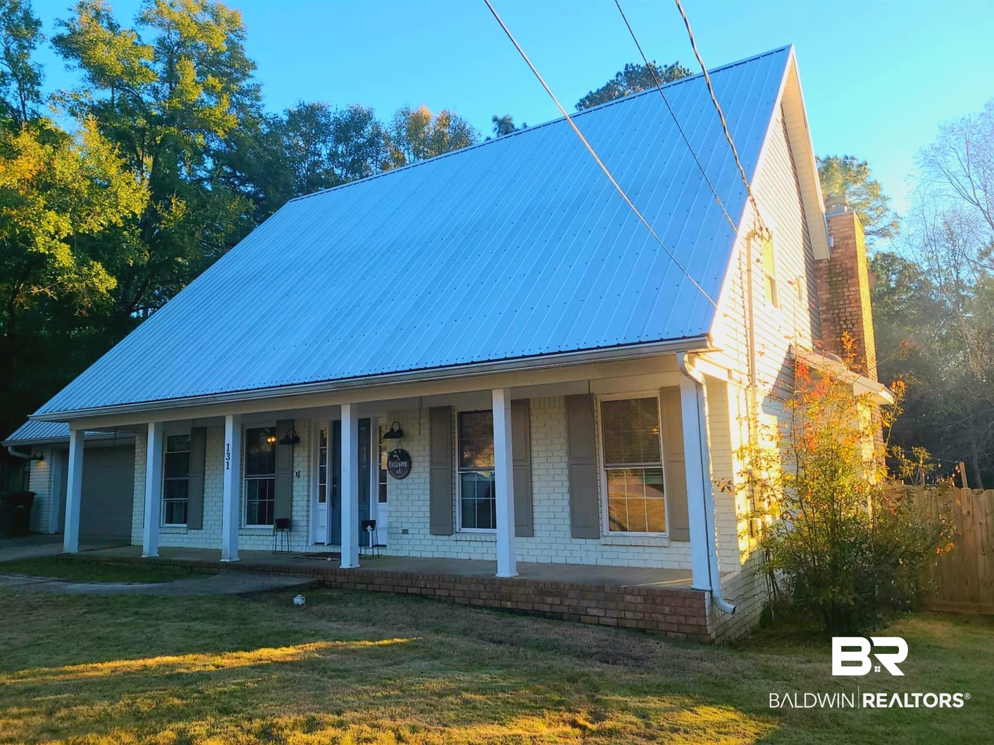 131 Marikesh Drive Daphne, AL 36526 - Photo 1 of 29 View of front of house featuring covered porch and a front lawn