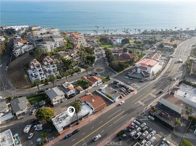 an aerial view of a city with ocean view