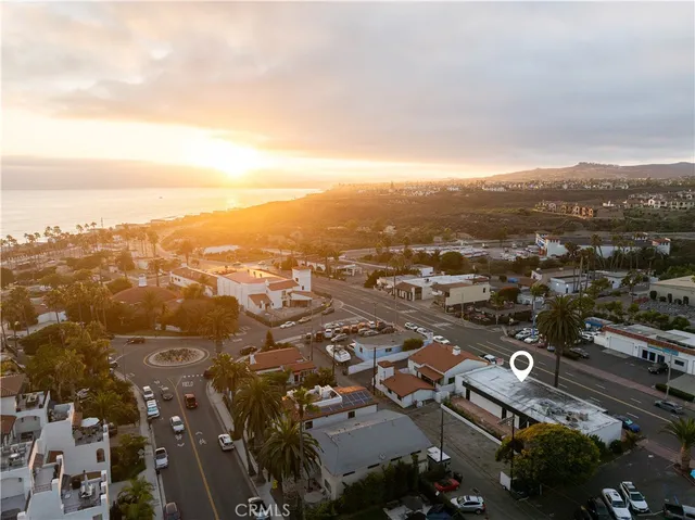 an aerial view of city and lake