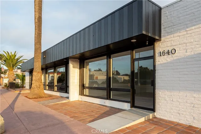 a black and white building with glass windows