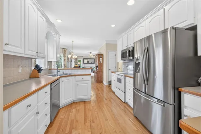 a room with toys and dresser with wooden floor