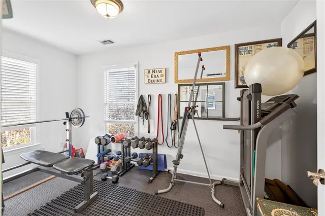 a bedroom with a bed and a bookshelf in it