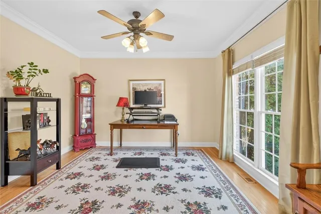 a living room with fireplace furniture and a flat screen tv