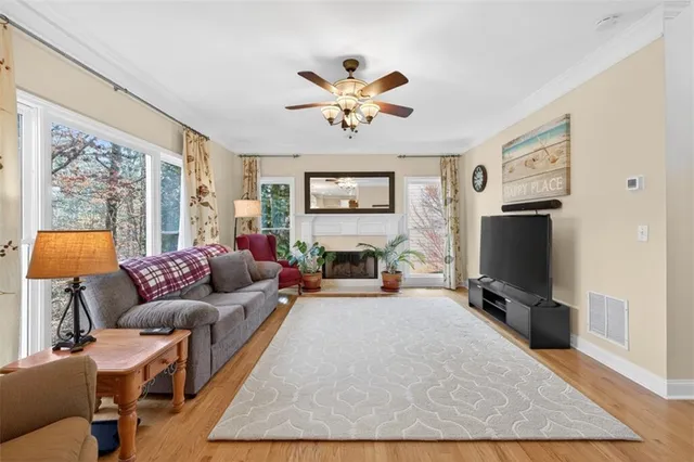 a kitchen with stainless steel appliances granite countertop a stove a sink a refrigerator and a microwave