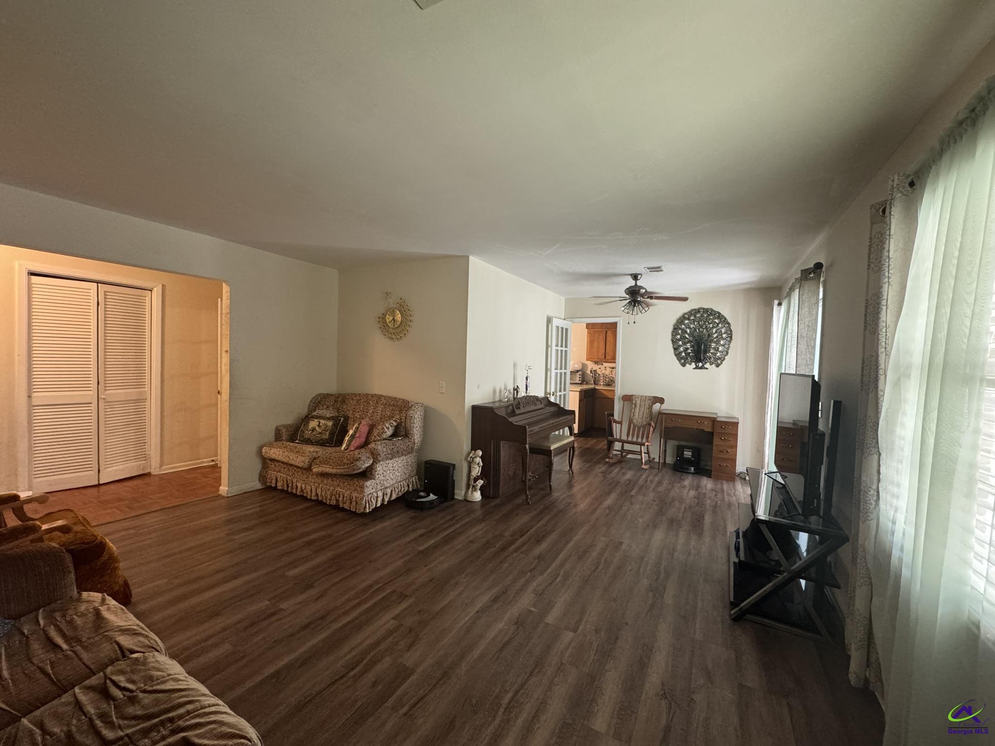 1032 Elberta Road Warner Robins, GA 31093 - Photo 23 of 26 a living room with furniture and a flat screen tv