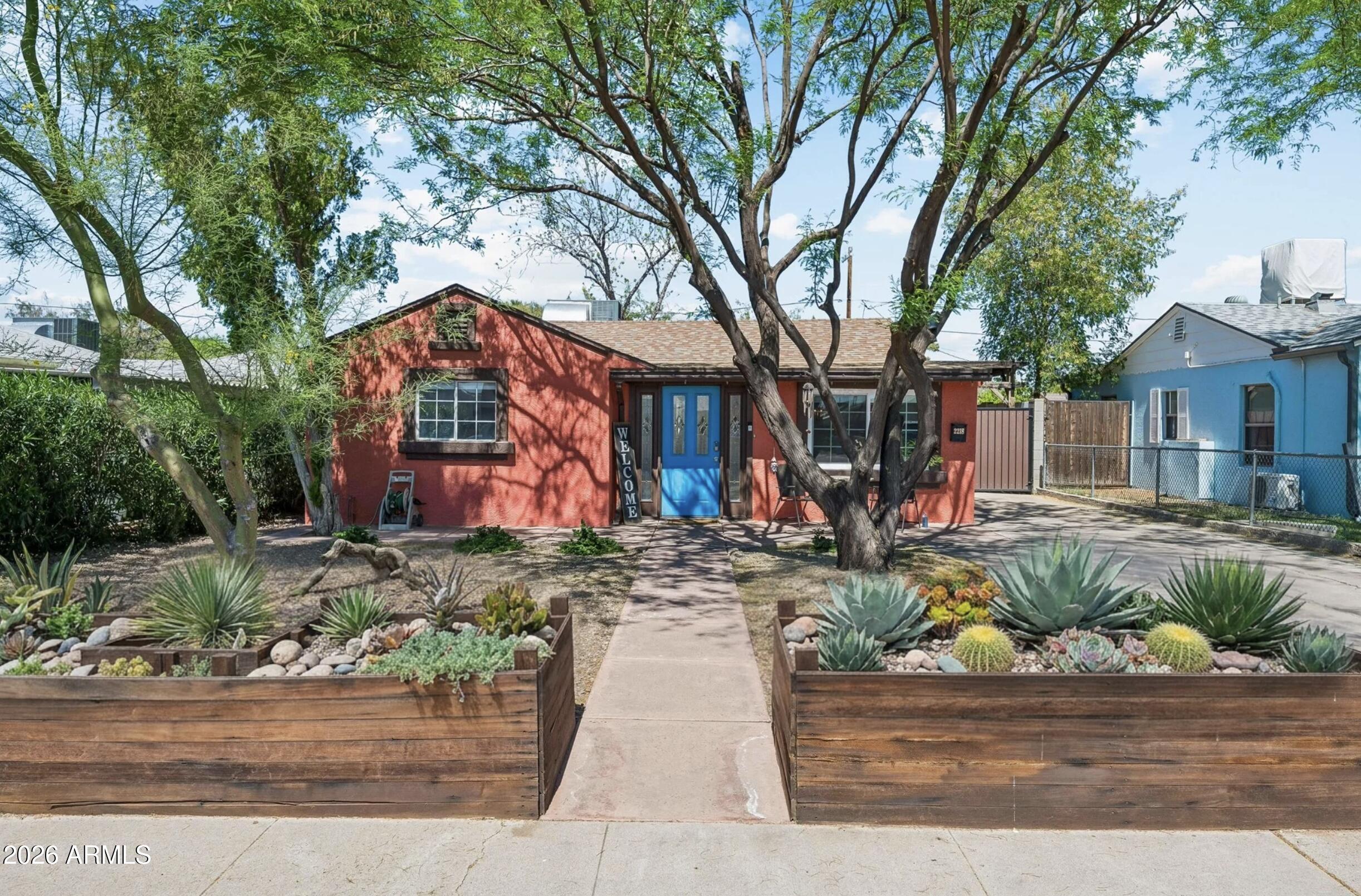front view of a house with a bench