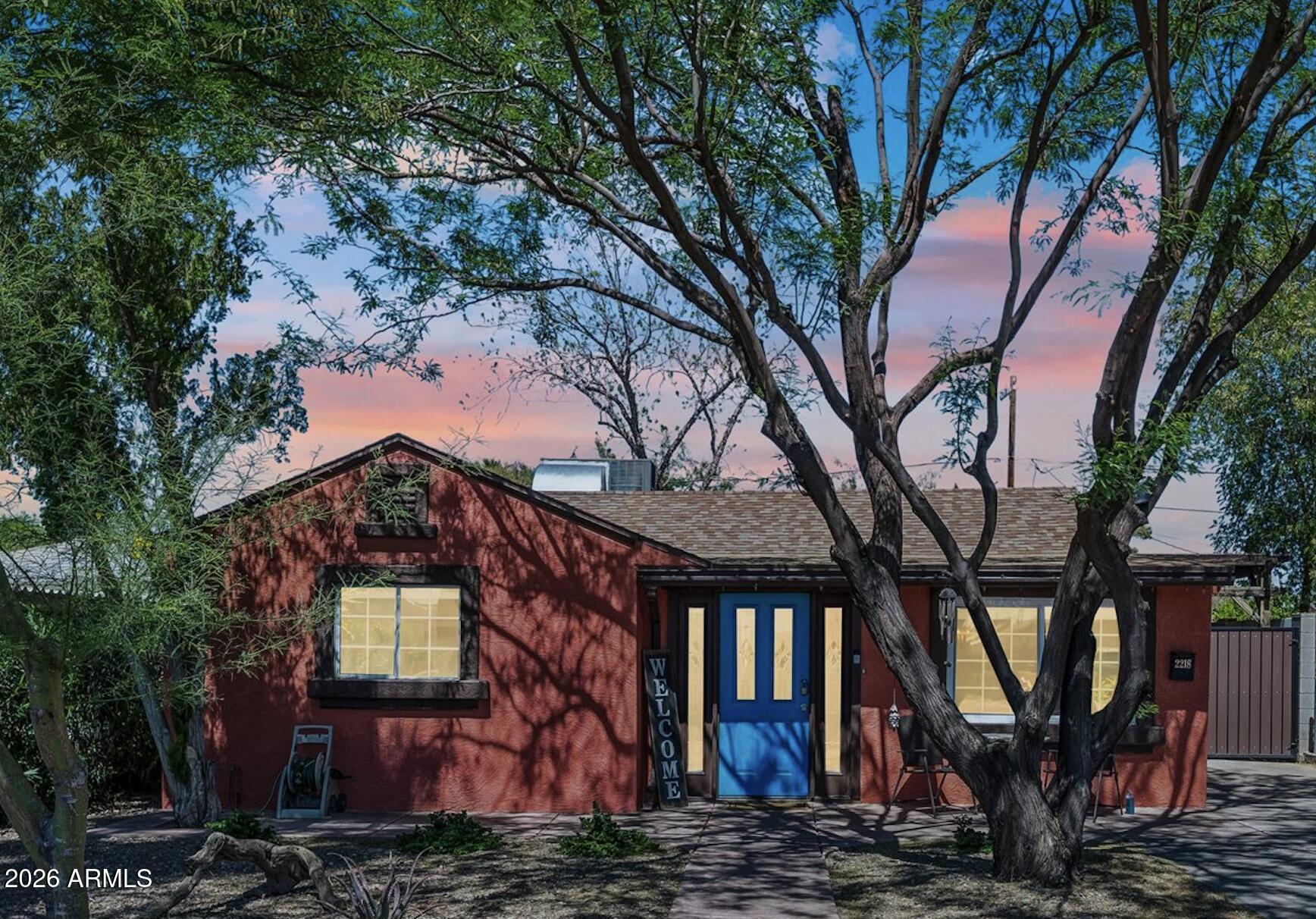 2218 East Yale Street Phoenix, AZ 85006 - Photo 2 of 35 a front view of a house with garden