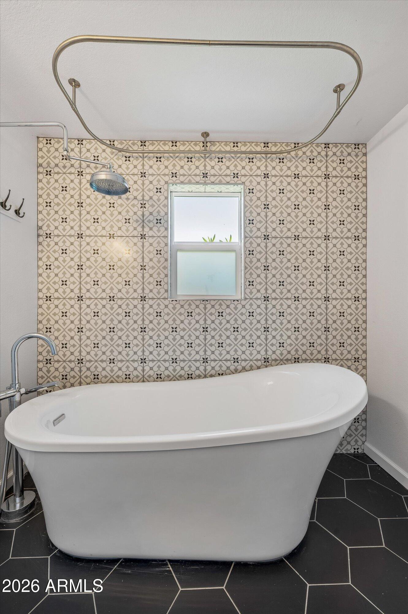 2218 East Yale Street Phoenix, AZ 85006 - Photo 23 of 35 a bathroom with a bathtub and shower