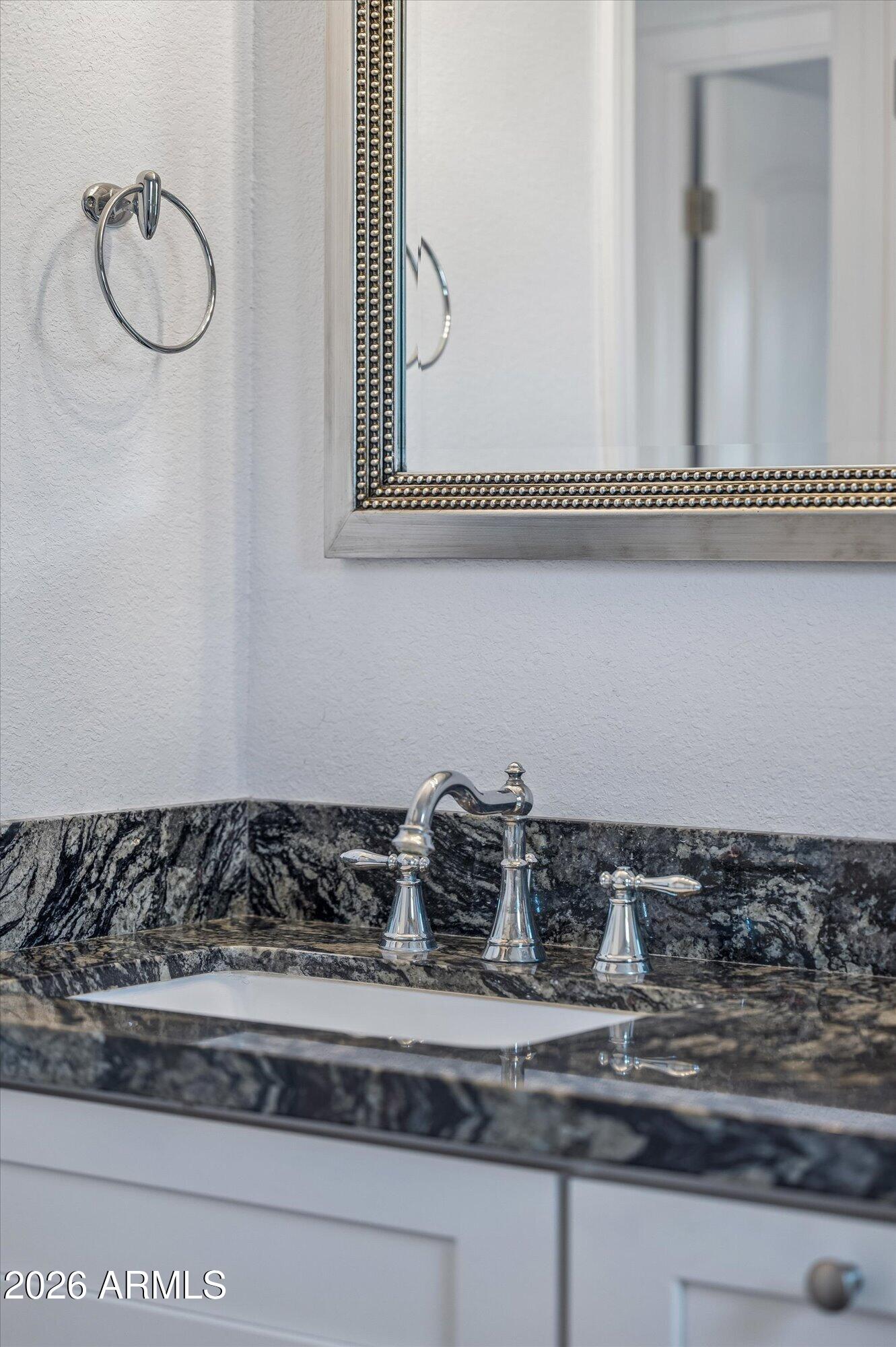 2218 East Yale Street Phoenix, AZ 85006 - Photo 24 of 35 a bathroom with a granite countertop sink and a mirror