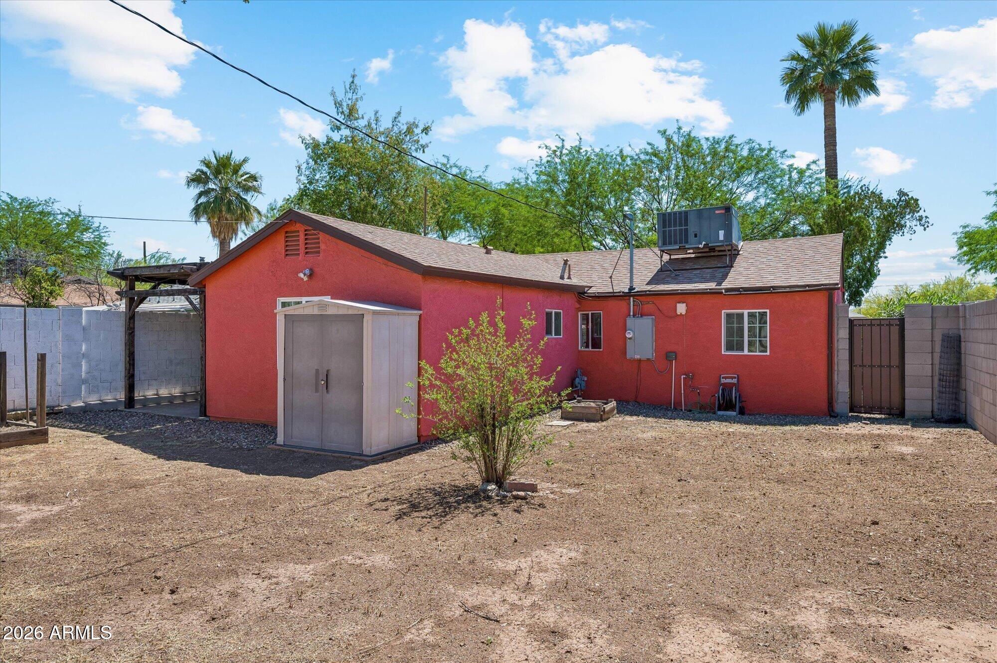 2218 East Yale Street Phoenix, AZ 85006 - Photo 29 of 35 a front view of a house with a yard and garage