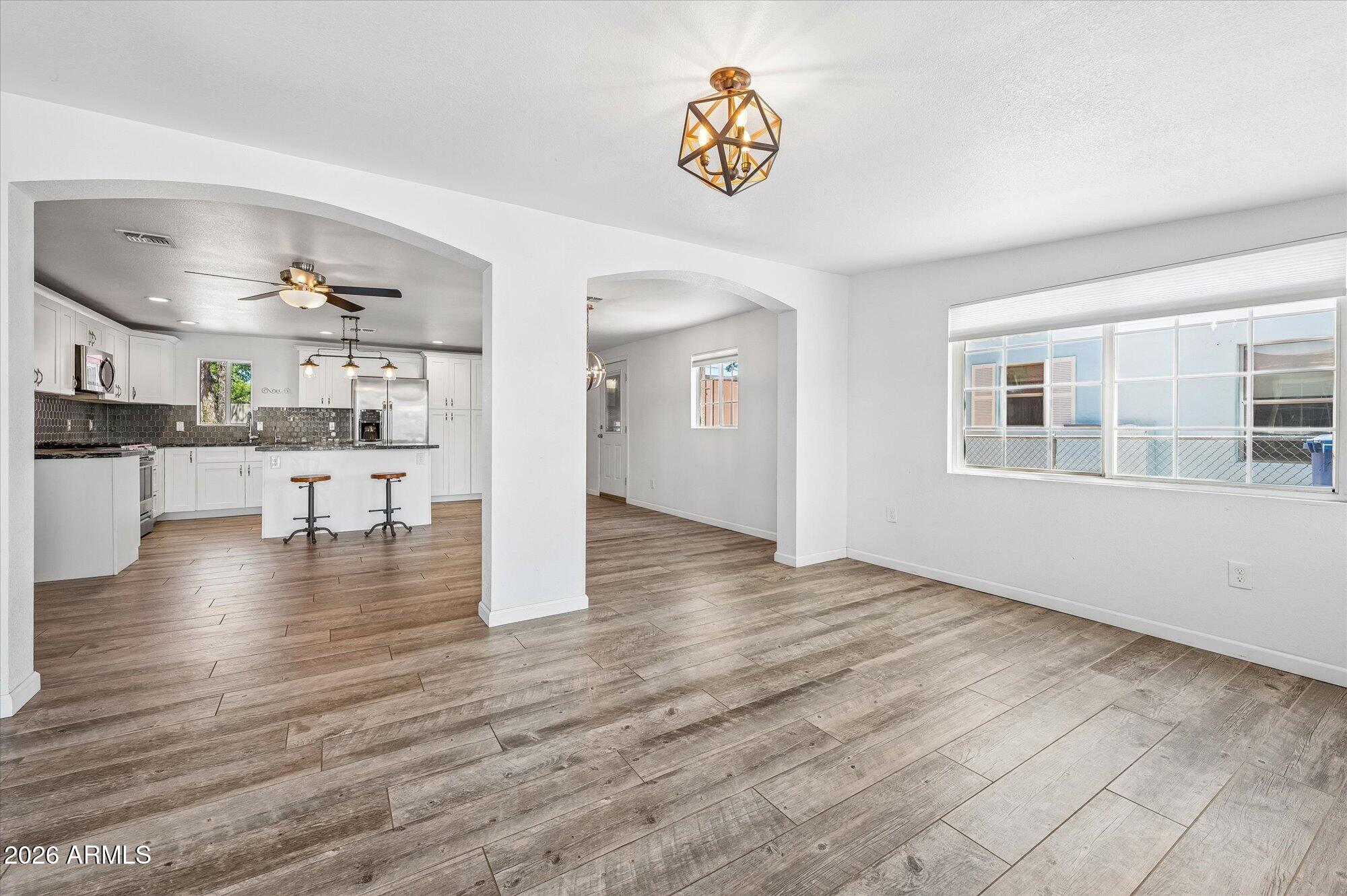 2218 East Yale Street Phoenix, AZ 85006 - Photo 8 of 35 a view of a kitchen with furniture and wooden floor