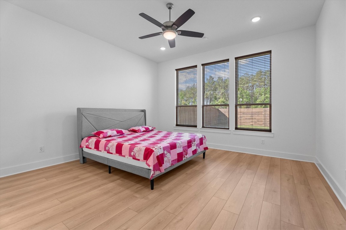 5030 Vly Wind Court Spring, TX 77386 - Photo 15 of 36 Primary bedroom with view to the backyard.