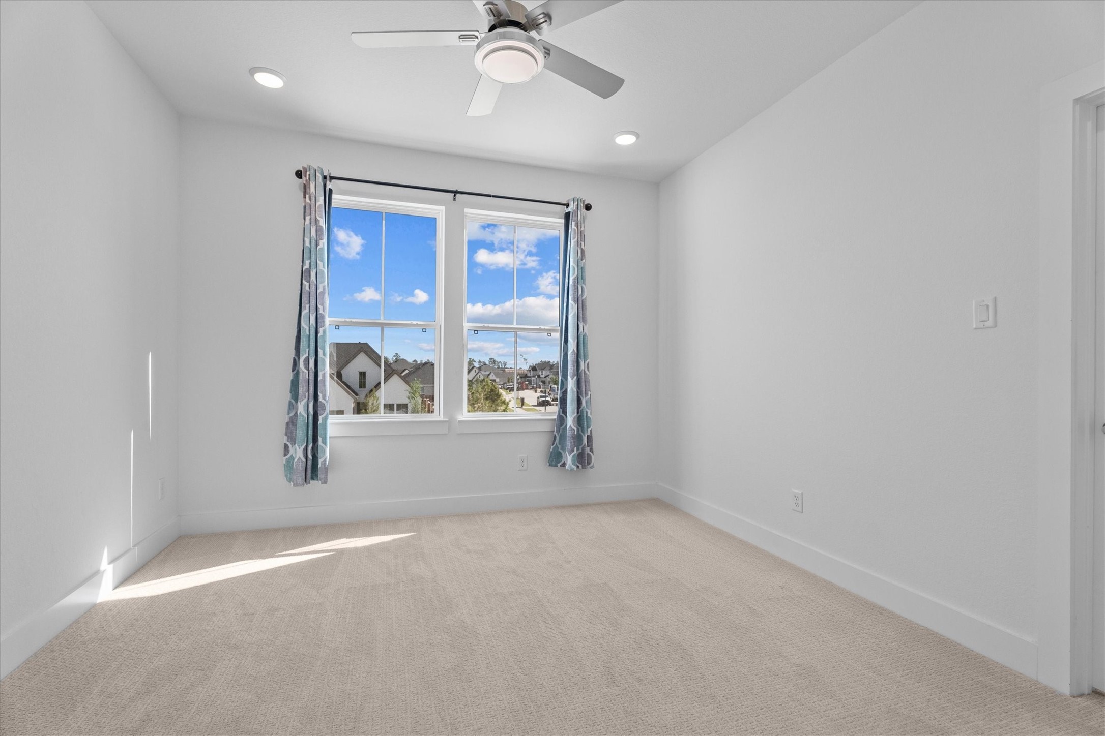 5030 Vly Wind Court Spring, TX 77386 - Photo 27 of 36 4th bedroom upstairs with lots of natural light and great view!