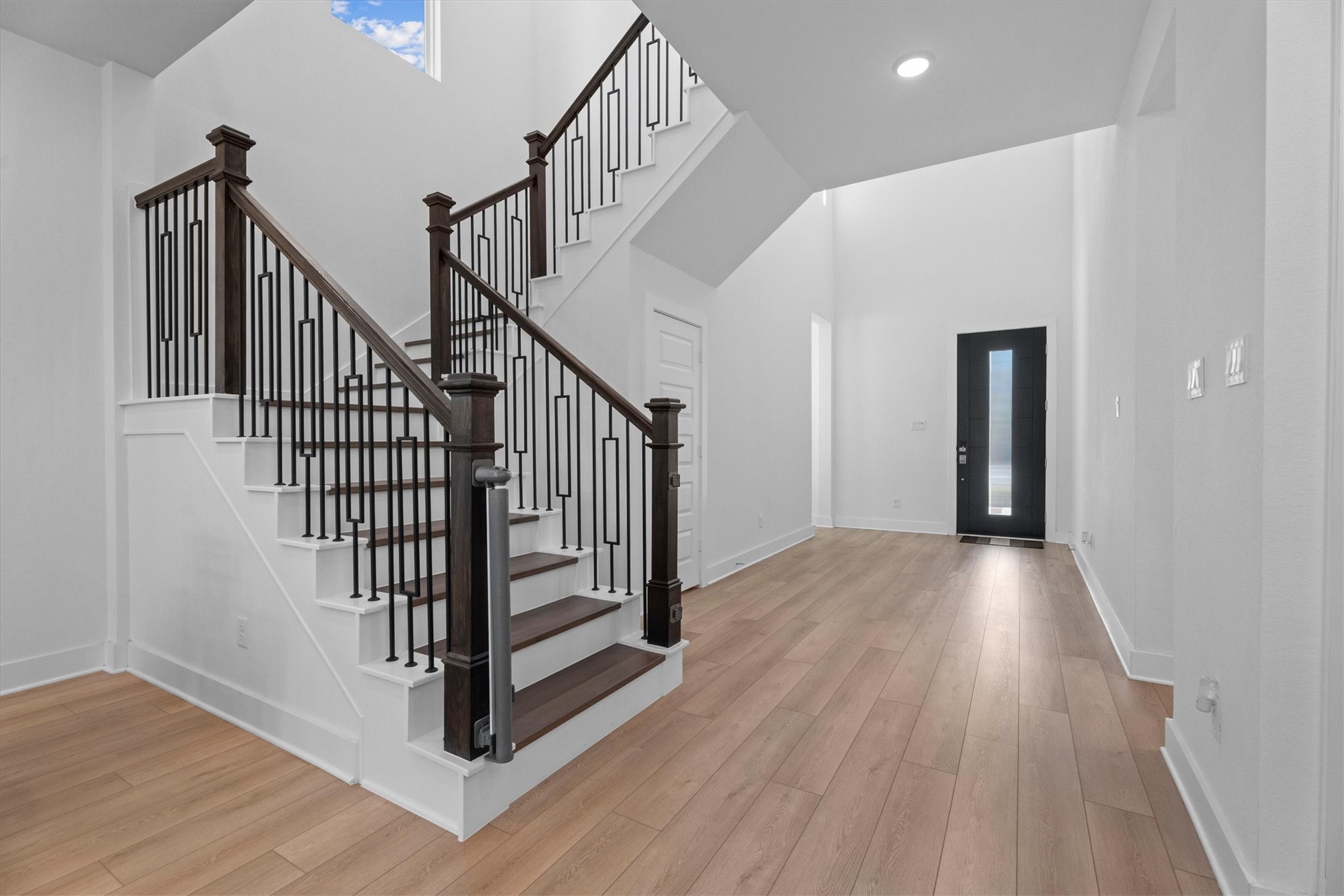 5030 Vly Wind Court Spring, TX 77386 - Photo 5 of 36 Luxury Vinyl plank in the main living areas and on the stairs.