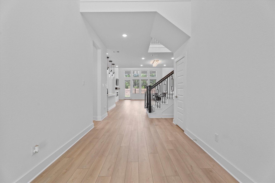 5030 Vly Wind Court Spring, TX 77386 - Photo 8 of 36 Grand entrance featuring lots of natural light and vinyl plank.