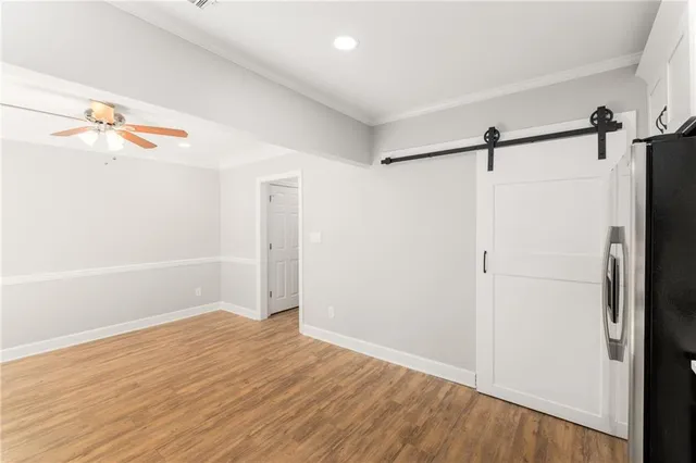 a view of a room with wooden floor