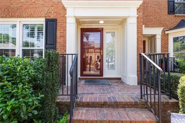 a front view of a house with a glass door