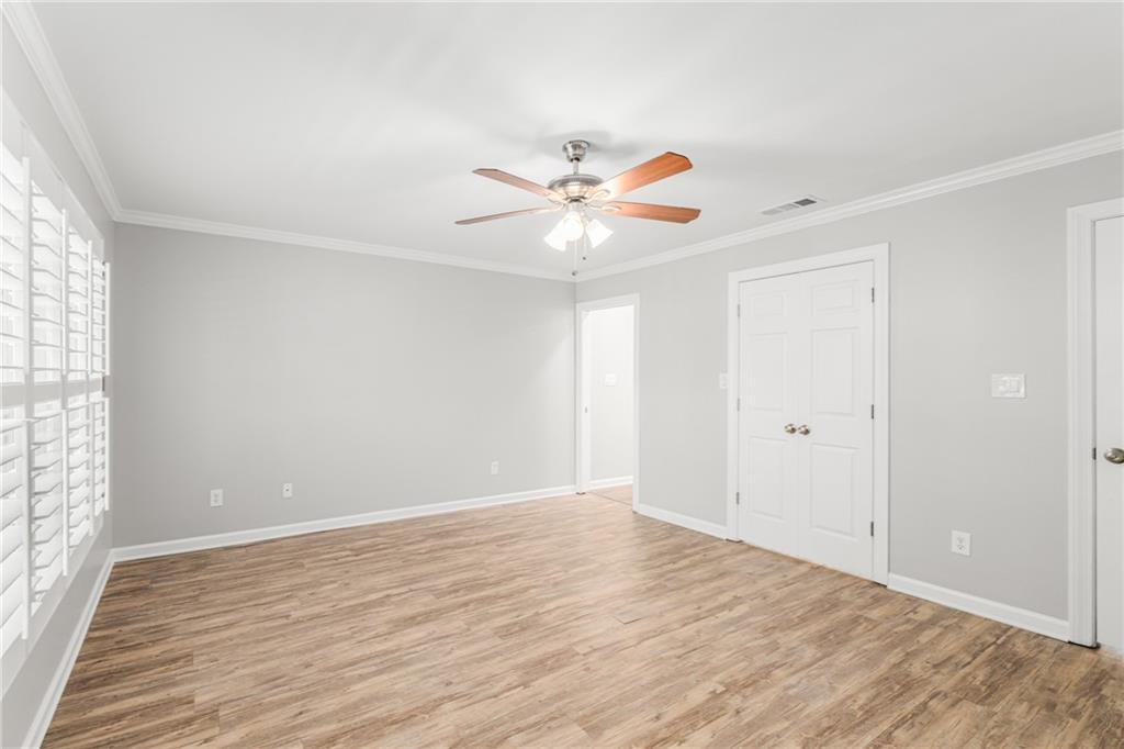 109 Mt Vernon Circle Sandy Springs, GA 30338 - Photo 21 of 37 wooden floor in an empty room with a window