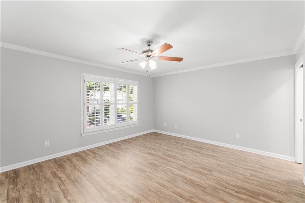 109 Mt Vernon Circle Sandy Springs, GA 30338 - Photo 22 of 37 wooden floor in an empty room with a window