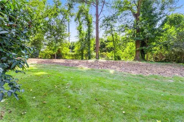 an aerial view of a house with yard swimming pool and outdoor seating