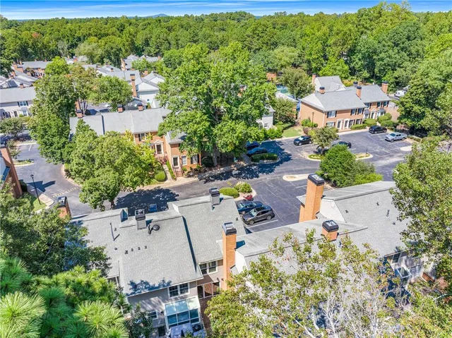 an aerial view of residential houses with outdoor space and street view