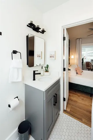 a bathroom with a sink and a mirror