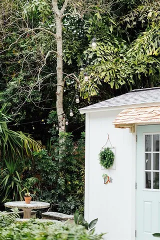a view of yard with seating space and trees