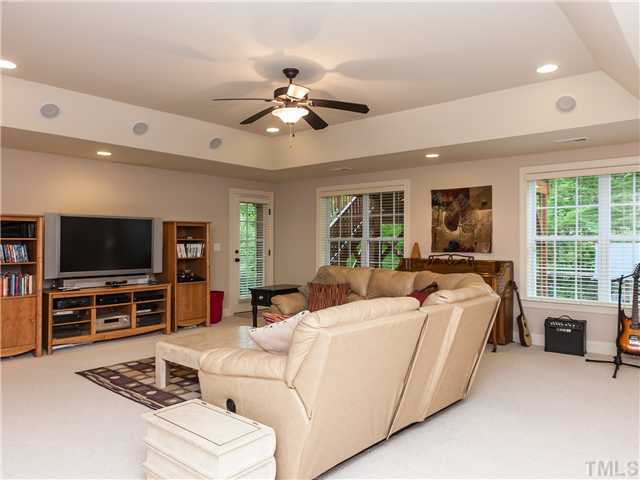 11520 Azari Court Raleigh, NC 27614 - Photo 19 of 24 a living room with furniture and a flat screen tv