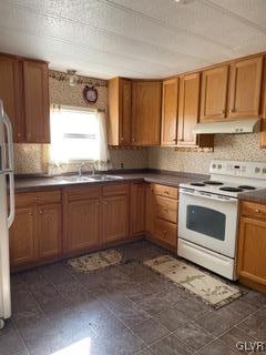 511 Fulmer Road Nazareth, PA 18064 - Photo 2 of 9 a kitchen with a stove sink and cabinets
