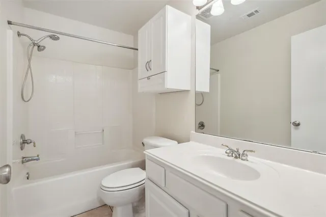 a bathroom with a sink a toilet and a bathtub