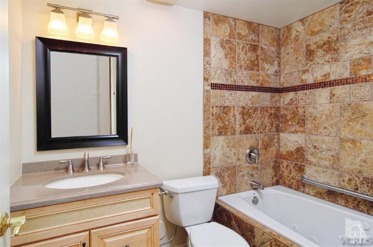 2796 Harrington Road Simi Valley, CA 93065 - Photo 2 of 15 a bathroom with a granite countertop sink toilet and shower