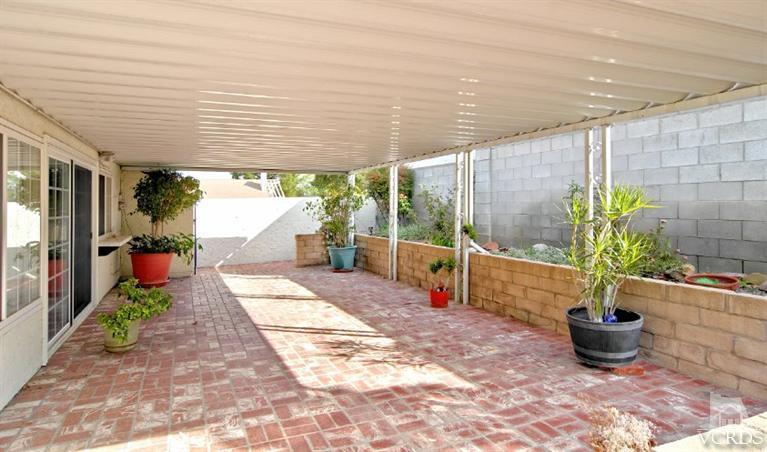 2796 Harrington Road Simi Valley, CA 93065 - Photo 4 of 15 a view of a patio with table and chairs potted plants