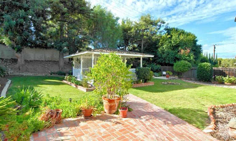 2796 Harrington Road Simi Valley, CA 93065 - Photo 6 of 15 a view of a backyard with potted plants and large trees
