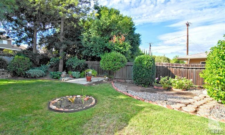 2796 Harrington Road Simi Valley, CA 93065 - Photo 9 of 15 a view of a backyard with plants and a tree