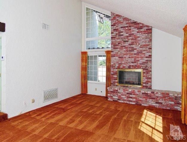 2796 Harrington Road Simi Valley, CA 93065 - Photo 10 of 15 a view of an empty room with a fireplace and a window
