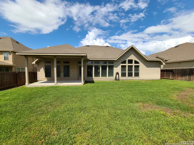 a view of a yard in front of a house
