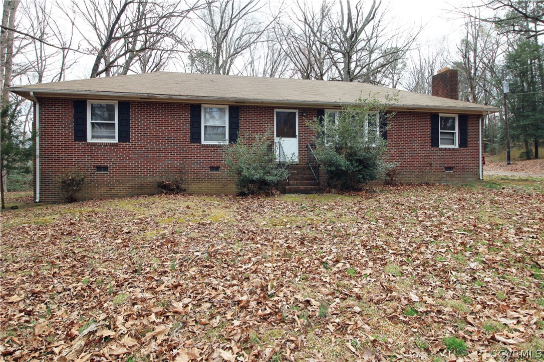 12821 Old Buckingham Road Midlothian, VA 23113 - Photo 1 of 50 a front view of a house with a garden