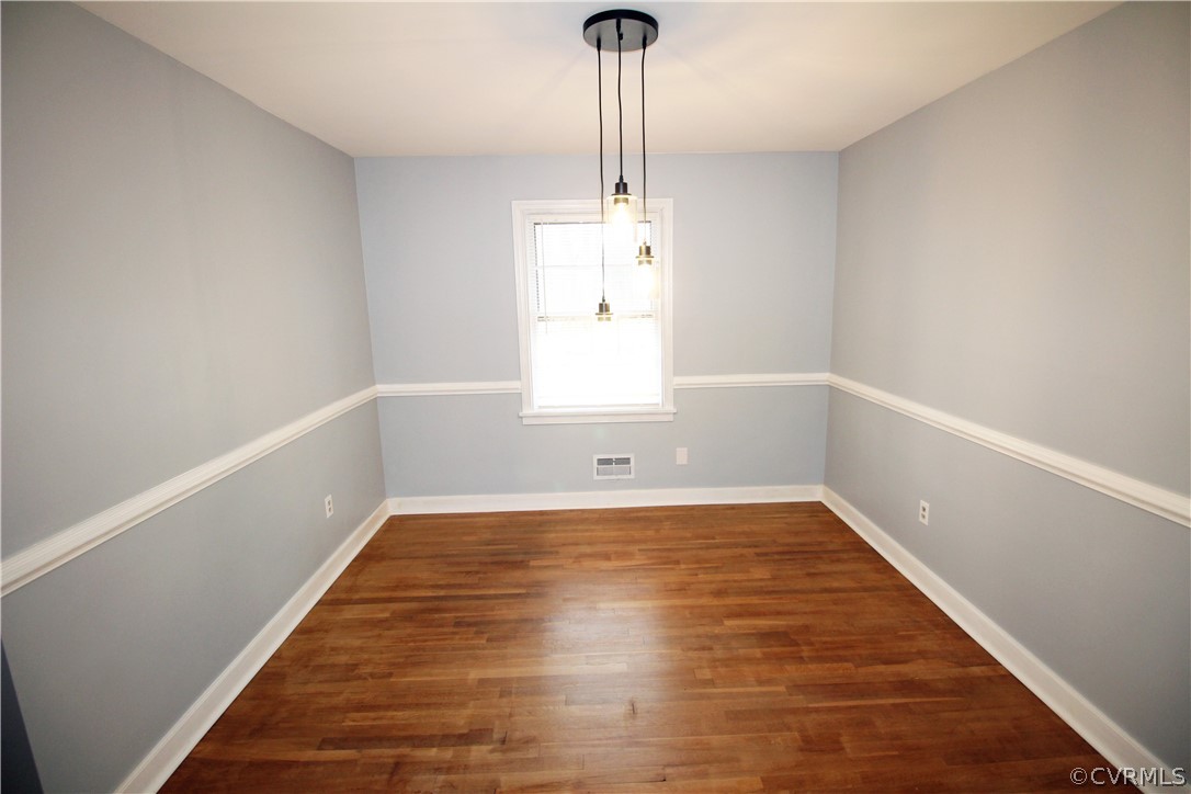 12821 Old Buckingham Road Midlothian, VA 23113 - Photo 14 of 50 a view of empty room with wooden floor and fan