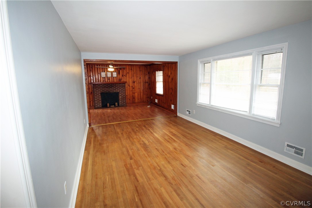 12821 Old Buckingham Road Midlothian, VA 23113 - Photo 17 of 50 an empty room with wooden floor and windows