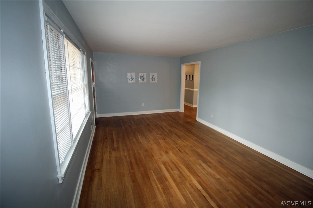 12821 Old Buckingham Road Midlothian, VA 23113 - Photo 19 of 50 an empty room with wooden floor and windows
