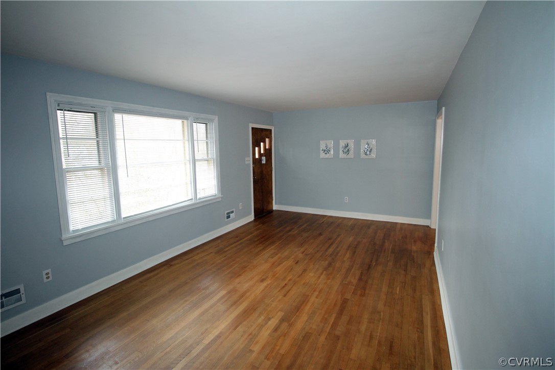 12821 Old Buckingham Road Midlothian, VA 23113 - Photo 20 of 50 an empty room with wooden floor and windows