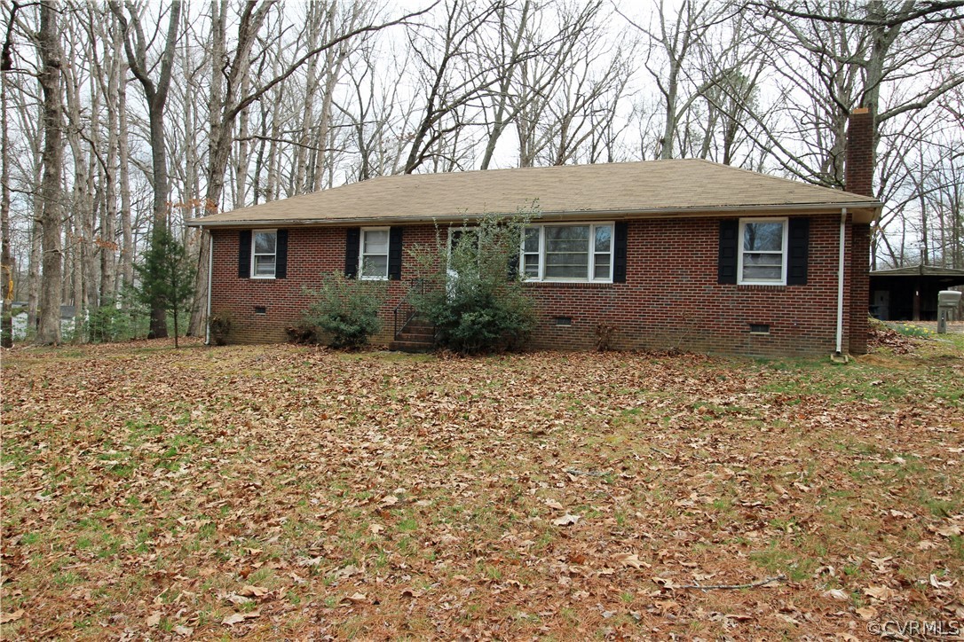 12821 Old Buckingham Road Midlothian, VA 23113 - Photo 2 of 50 a front view of a house with a yard