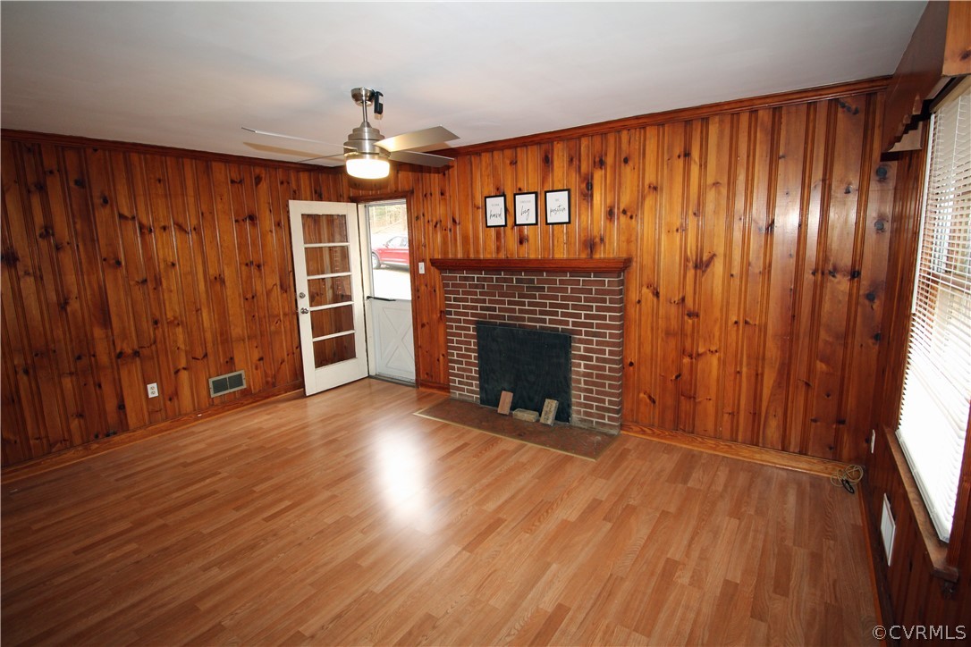 12821 Old Buckingham Road Midlothian, VA 23113 - Photo 21 of 50 wooden floor and windows in an empty room